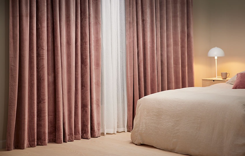 BOLGA black out roller blinds keep out the light from the bedroom and AUSTRA creates a cave-like atmosphere Cave-like atmosphere in bedroom with black out roller blinds and heavy curtains