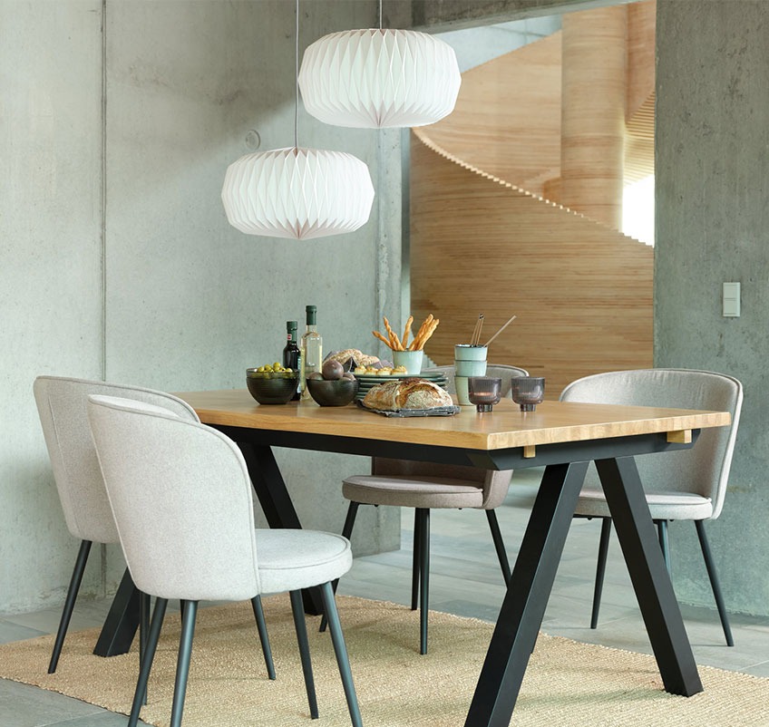 Dining table with four dining chairs in grey with black legs and two white pendants