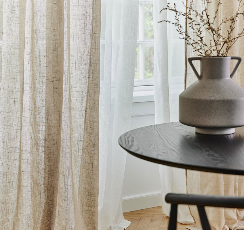 White STORAVAN and khaki AGA linen-look curtains Khaki and white sheer curtain in front of window